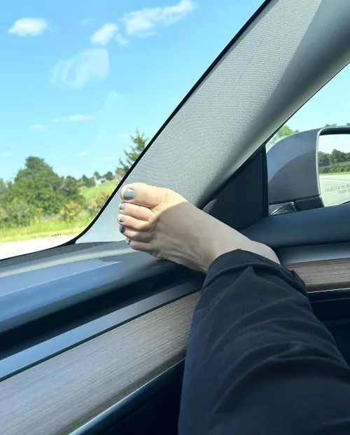 Arab feet on dashboard 