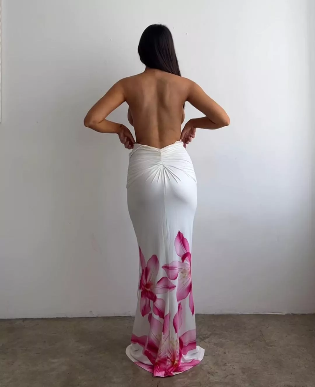 She can't hide them, their sides are visible even from behind