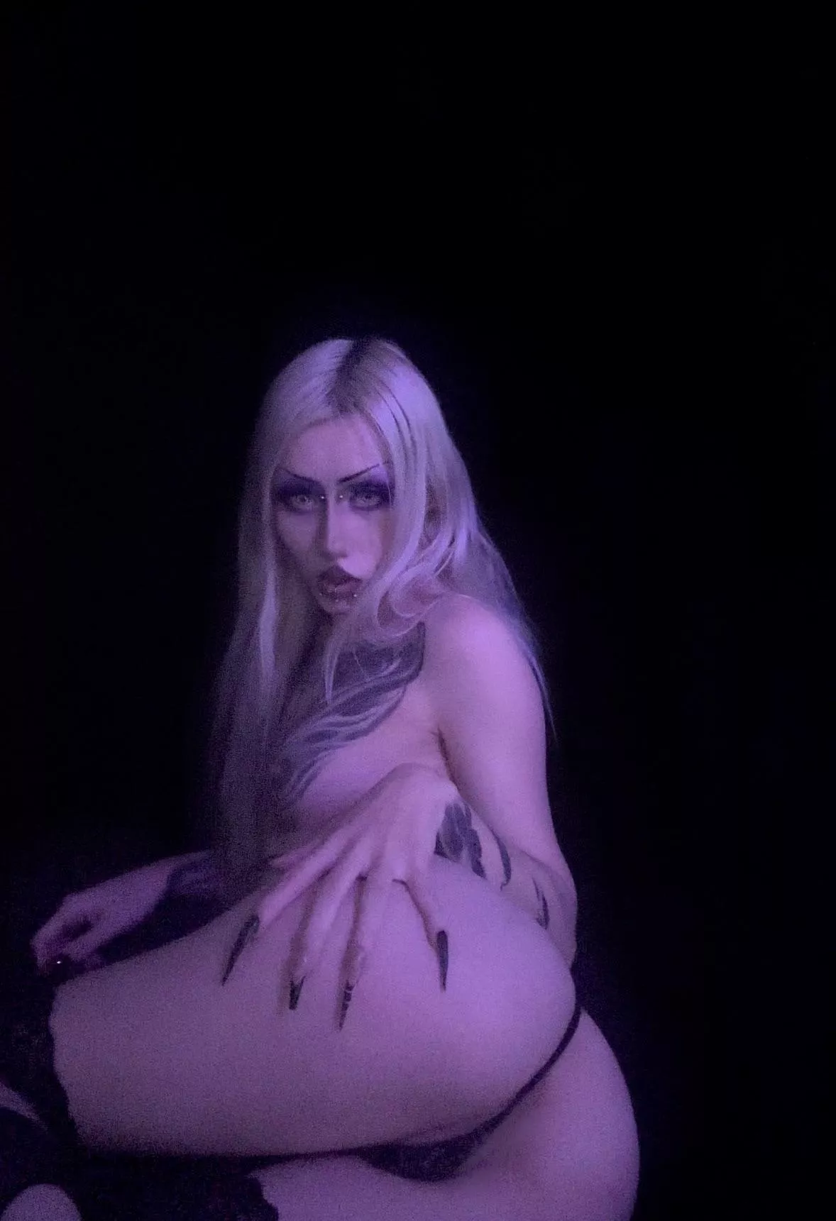 Just a goth girl with her vampire eyes.