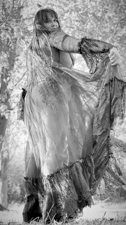 An autumnal goddess reveals curves 