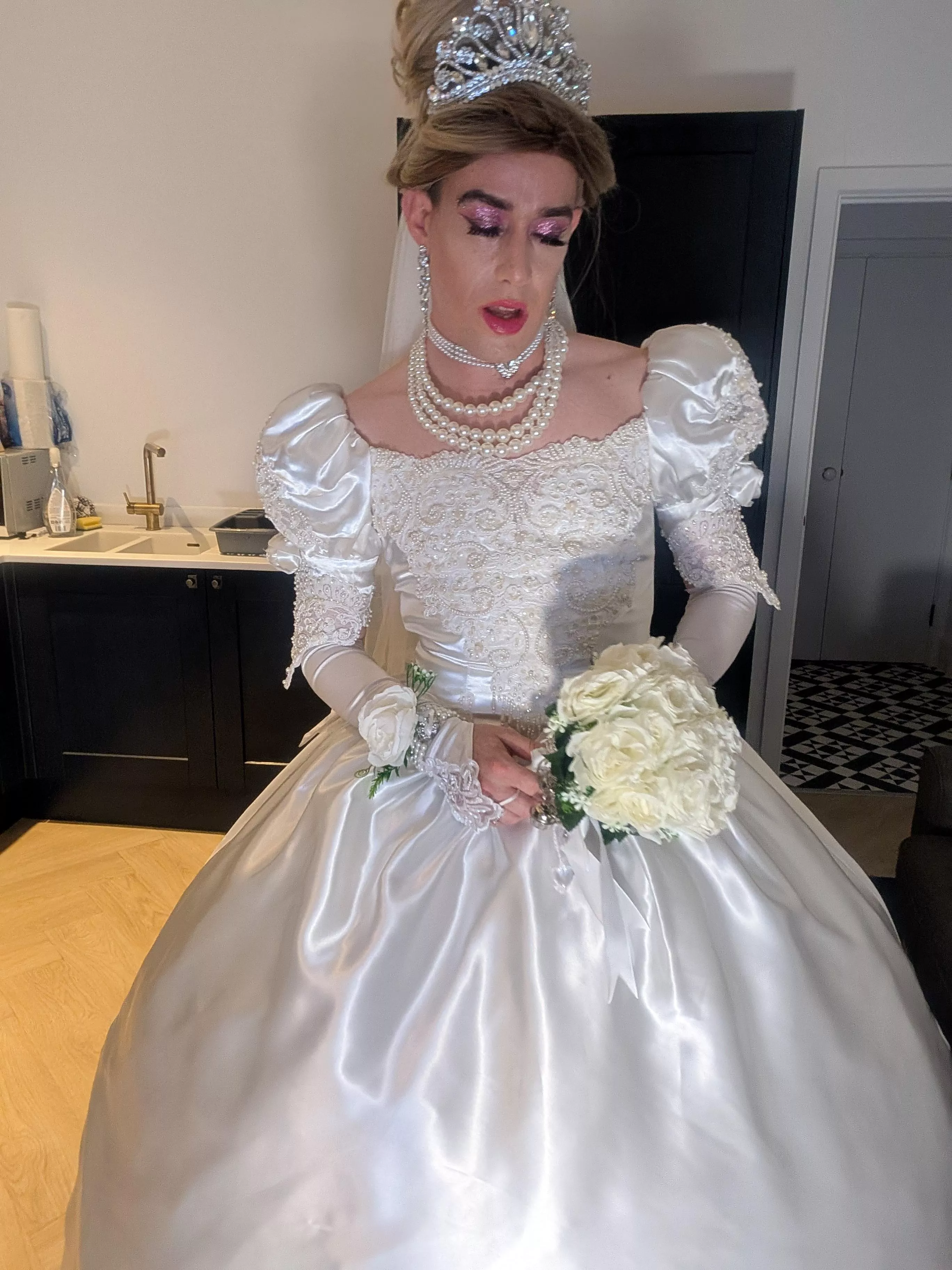 Can you guess what's underneath the wedding dress? 