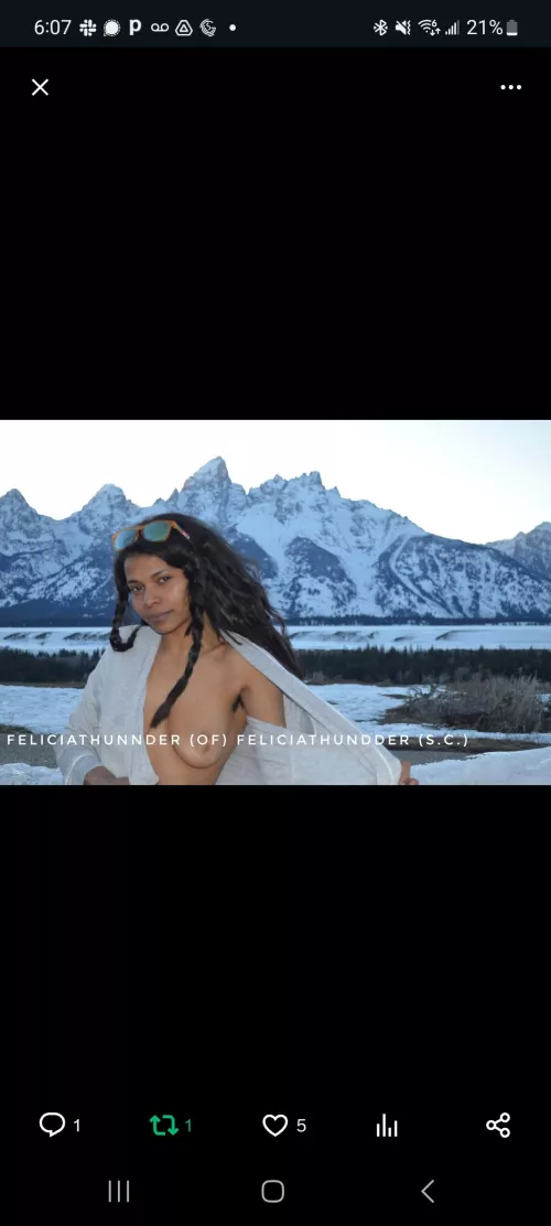 Grand tits infront of some mountains 