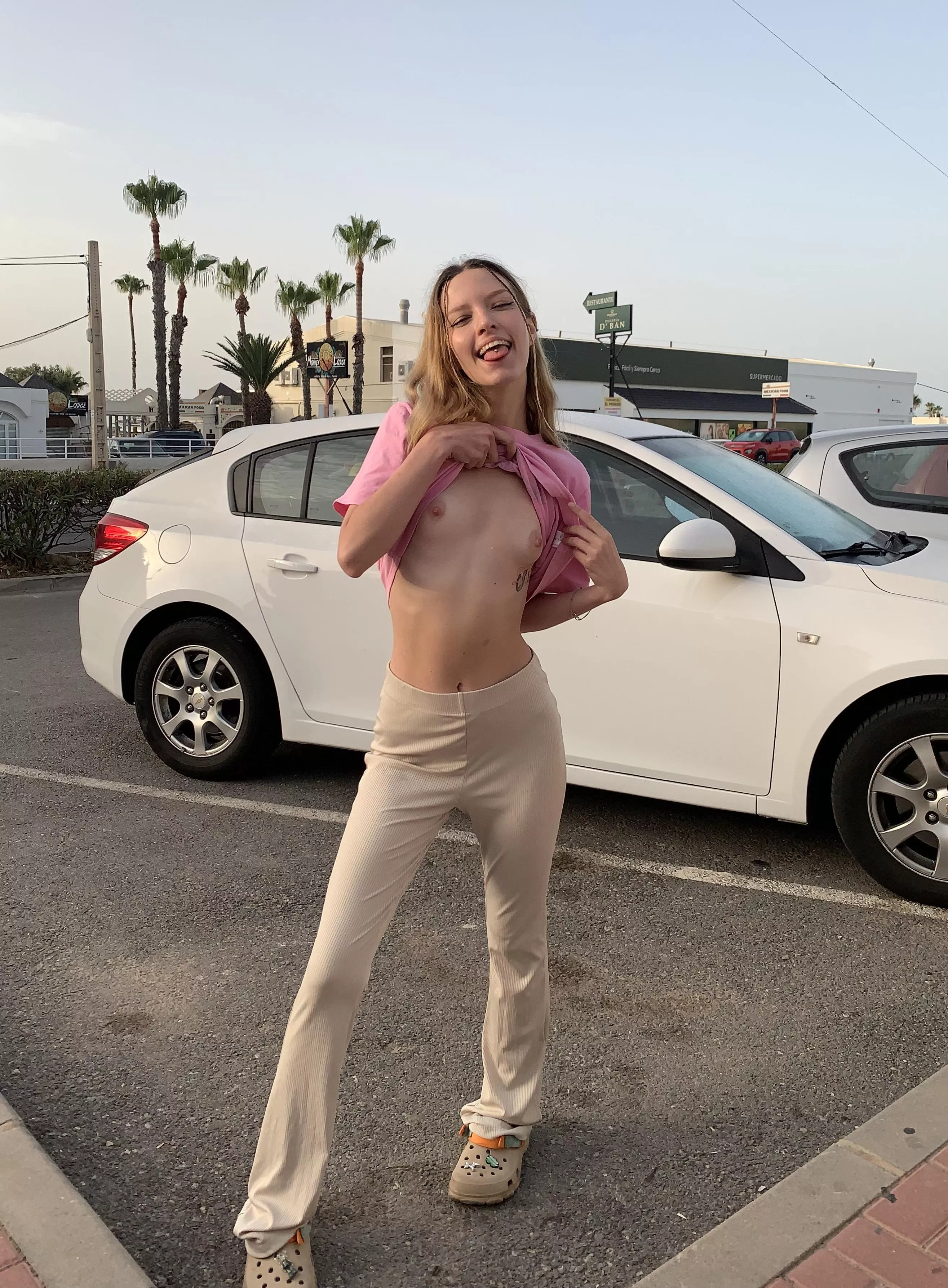 Mia shows her little tits