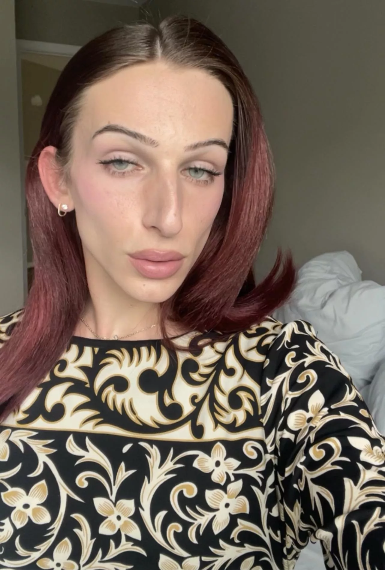 A beautiful femme queen, with a hung girl cock. Can you guess how big it is?