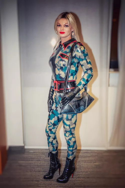Camo pattern military style catsuit. Self made. Also robust handbag out of real used Harley rear tire inner tube. Posing here in Essen Germany at EFM event.