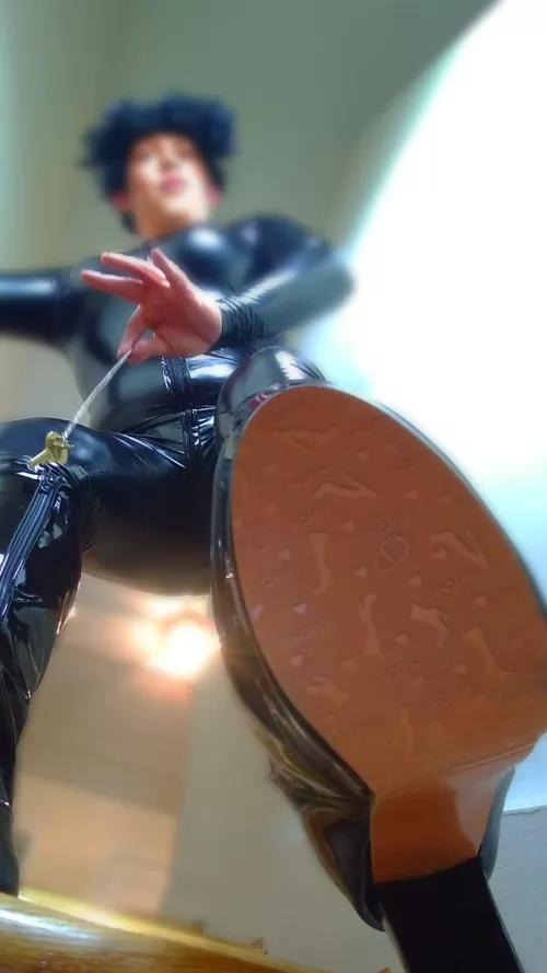 This is the uniform of your destruction: tight, shiny, and contains the key to your release