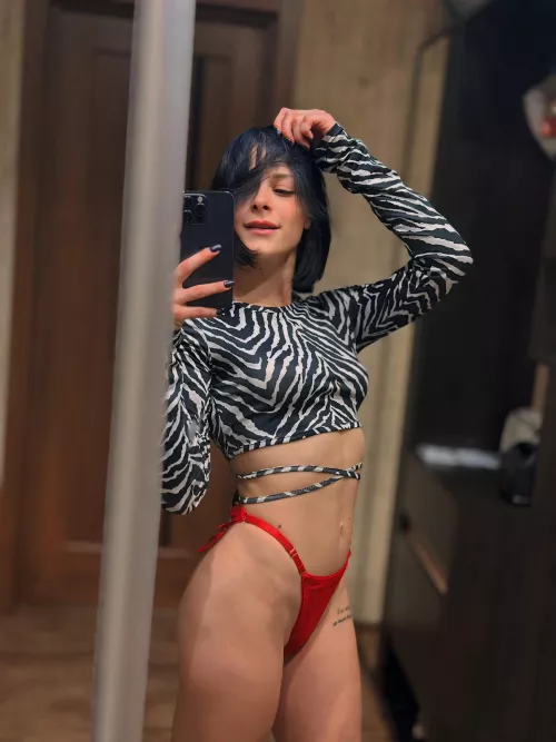 admiring my flat tummy in the mirror