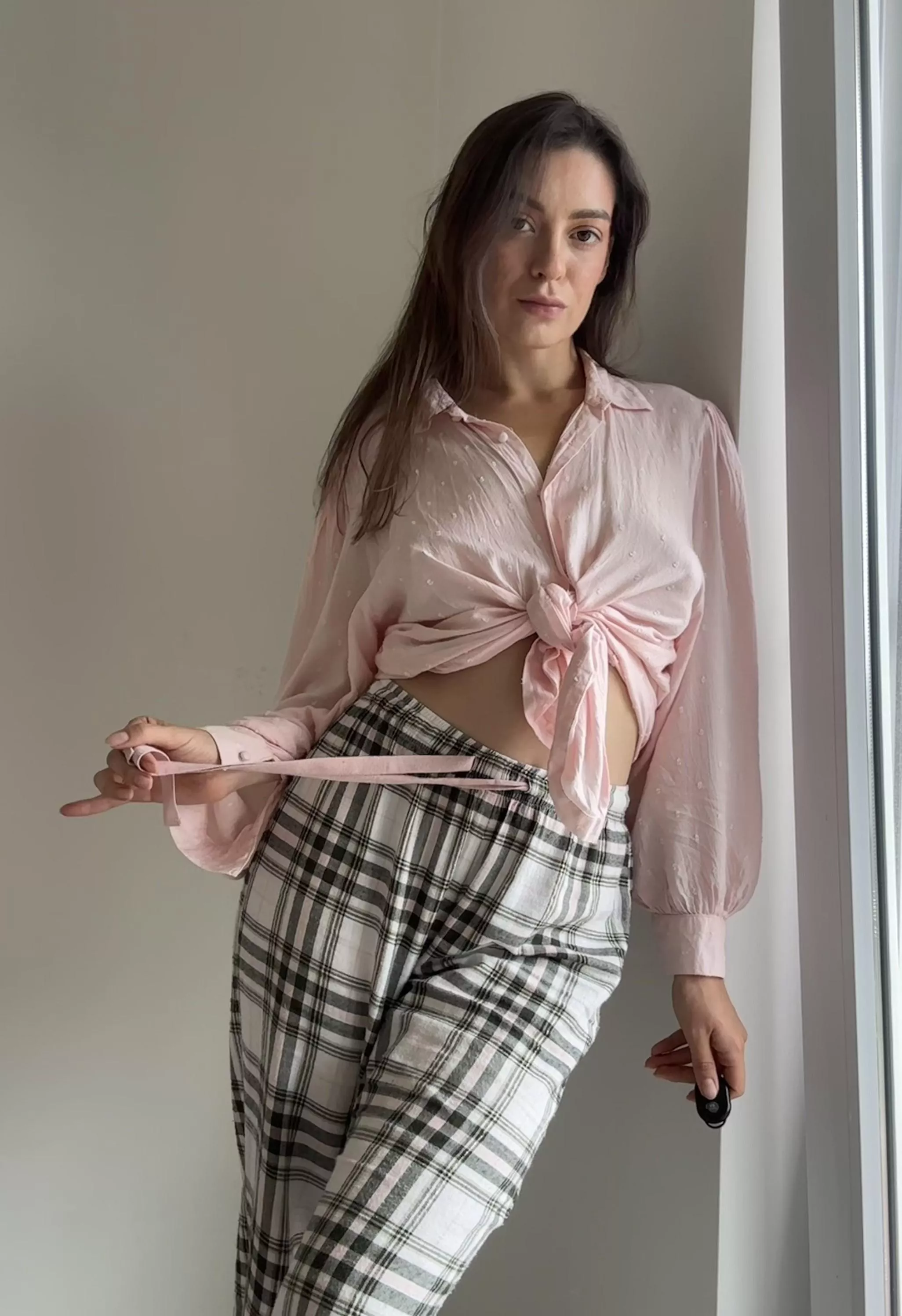 The blouse and pants leave just enough room for imagination...