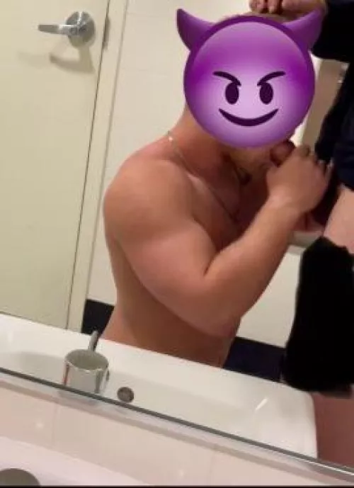 muscle bottom sucking a hung cock in a public bathroom ;)