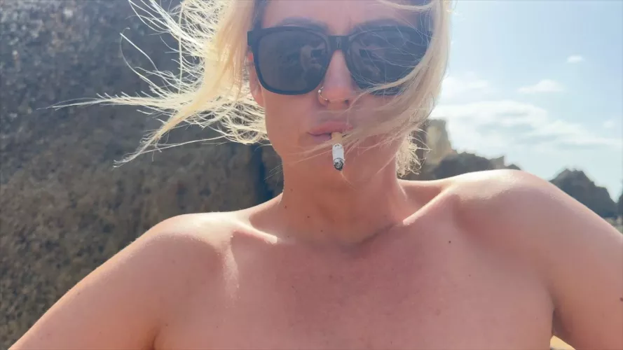 Smoking provocative at the nude beach 🔥
