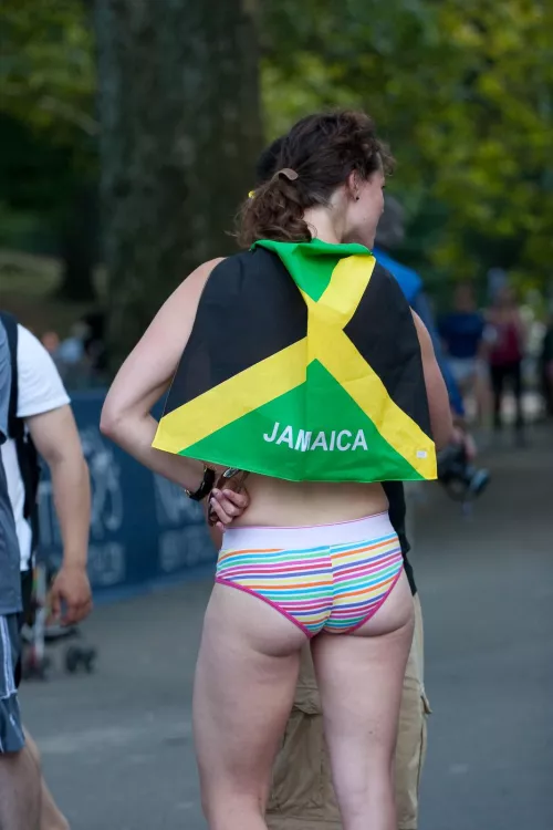 White girl shows off her ass in public, wearing the flag of Jamaica (New York, 2010)