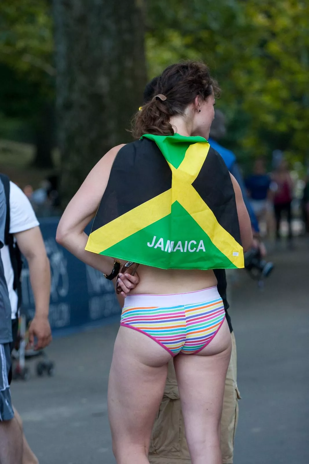 White girl shows off her ass in public, wearing the flag of Jamaica (New York, 2010)