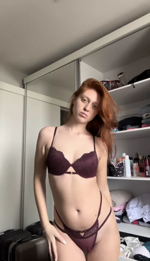 Sexy petite redhead , somethings peaking down there..