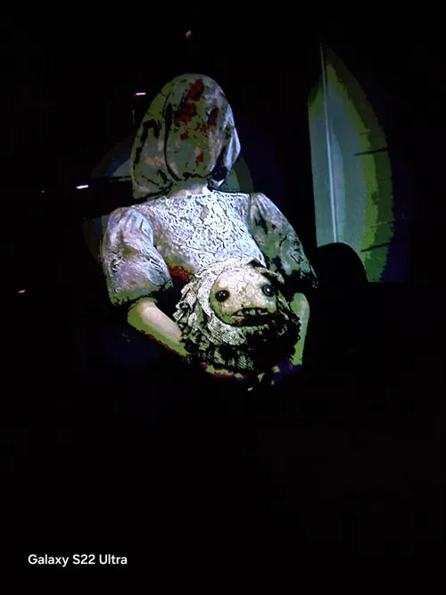 I posted a question about this ghost girl so I replayed and took a pic of her to see if our house is haunted or its a easter egg because it was weird to pop up so who is she or is it a ghost to be learned about later ?