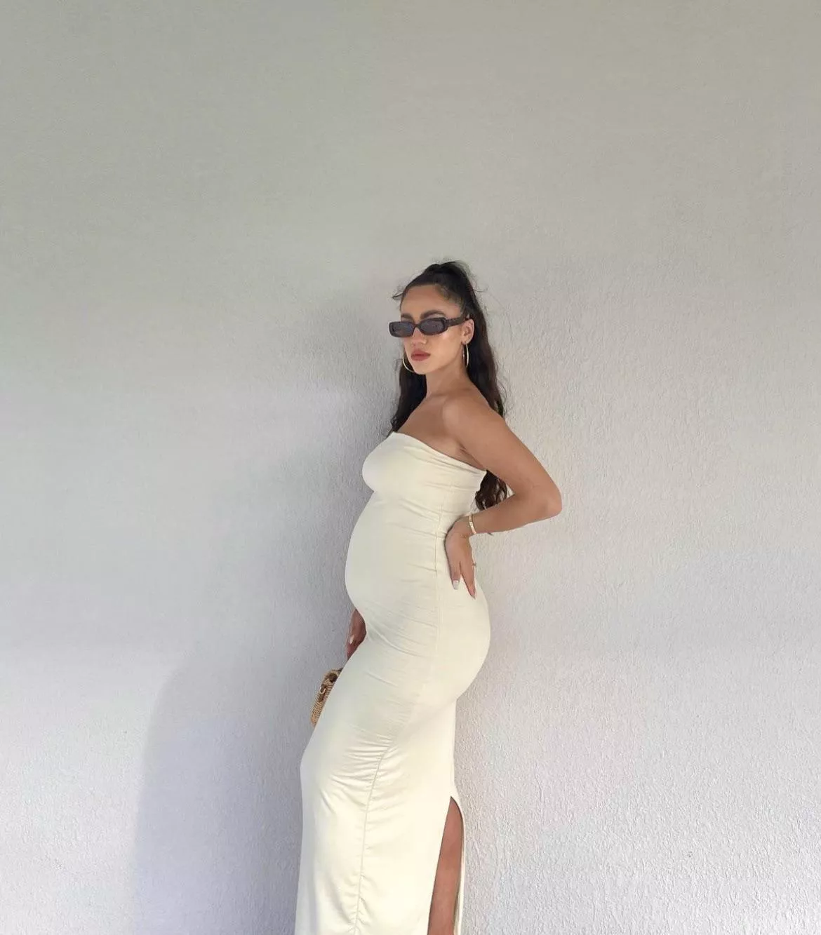 Pregnant Alesia Limongelli in white dress