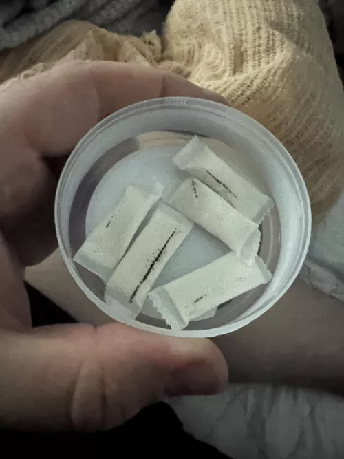 What the hell are these black lines and marks? Is this safe to still use? Zonnic pouches from Canada