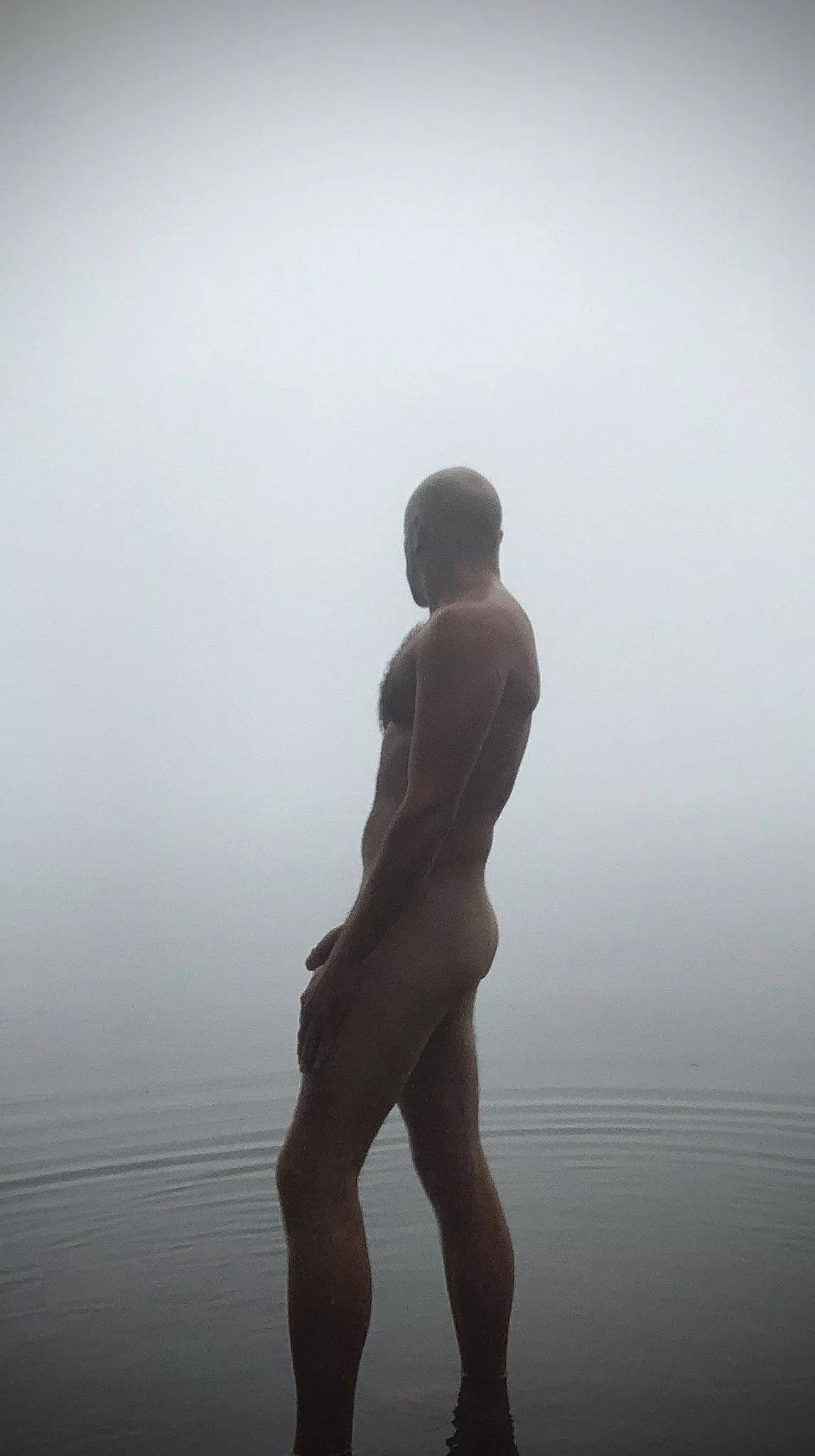 Foggy Autumn morning cold dip in the lake.