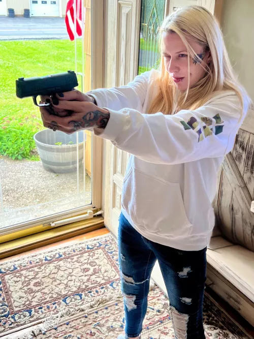 Girl who likes to handle guns 
