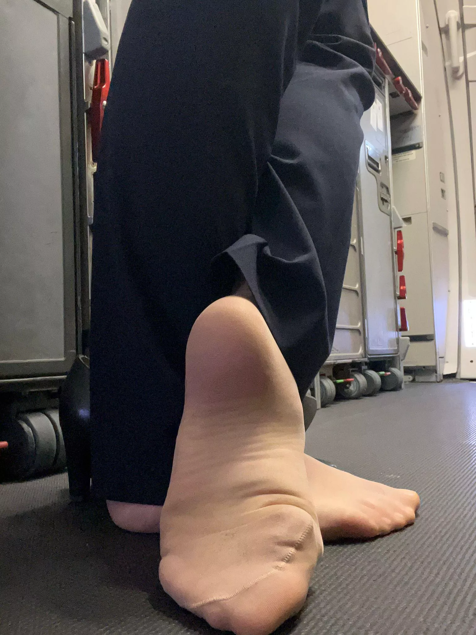 You come into the back of the airplane and see my chilling without my heels ...