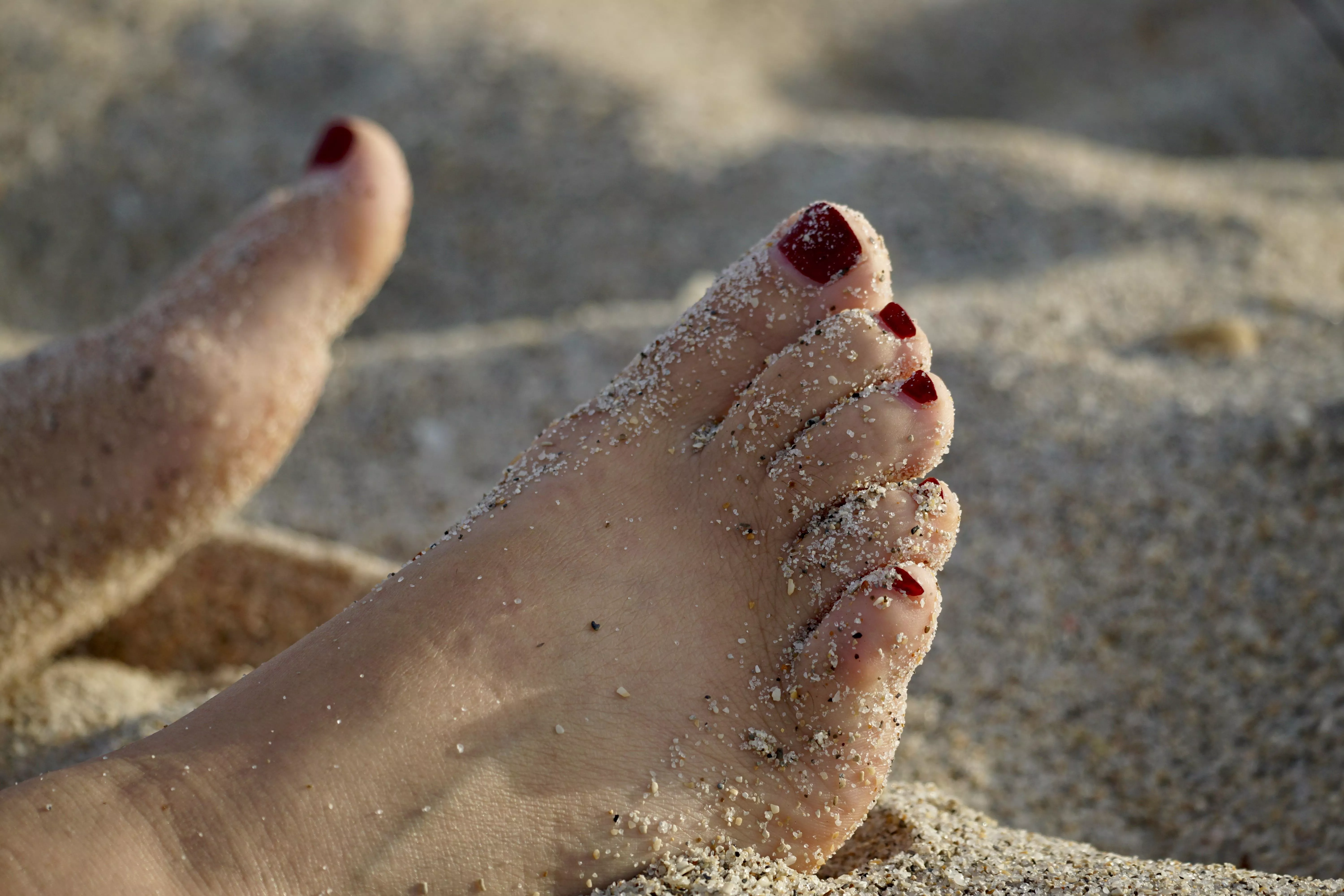 I got a drink in my hand, got my toes in the sand…