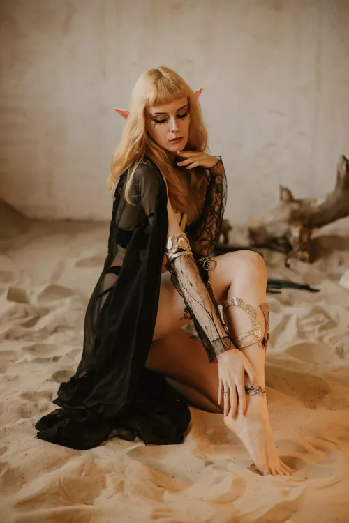 Hot elf on a hot sand