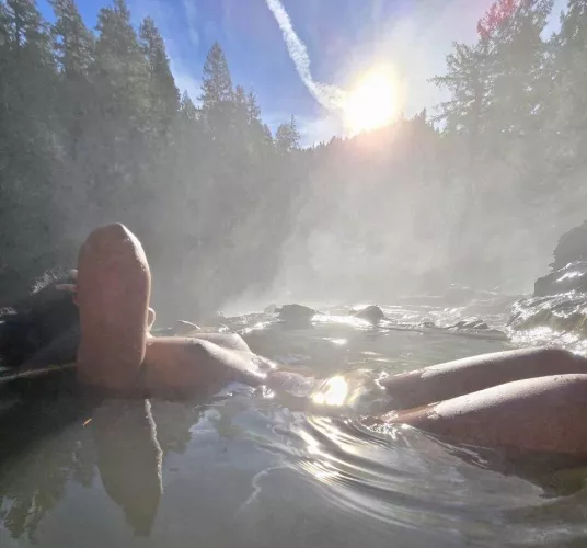 Steaming waters, serene views, and the perfect touch of warmth!