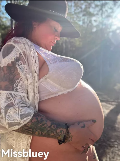 Pregnant outdoors. 
