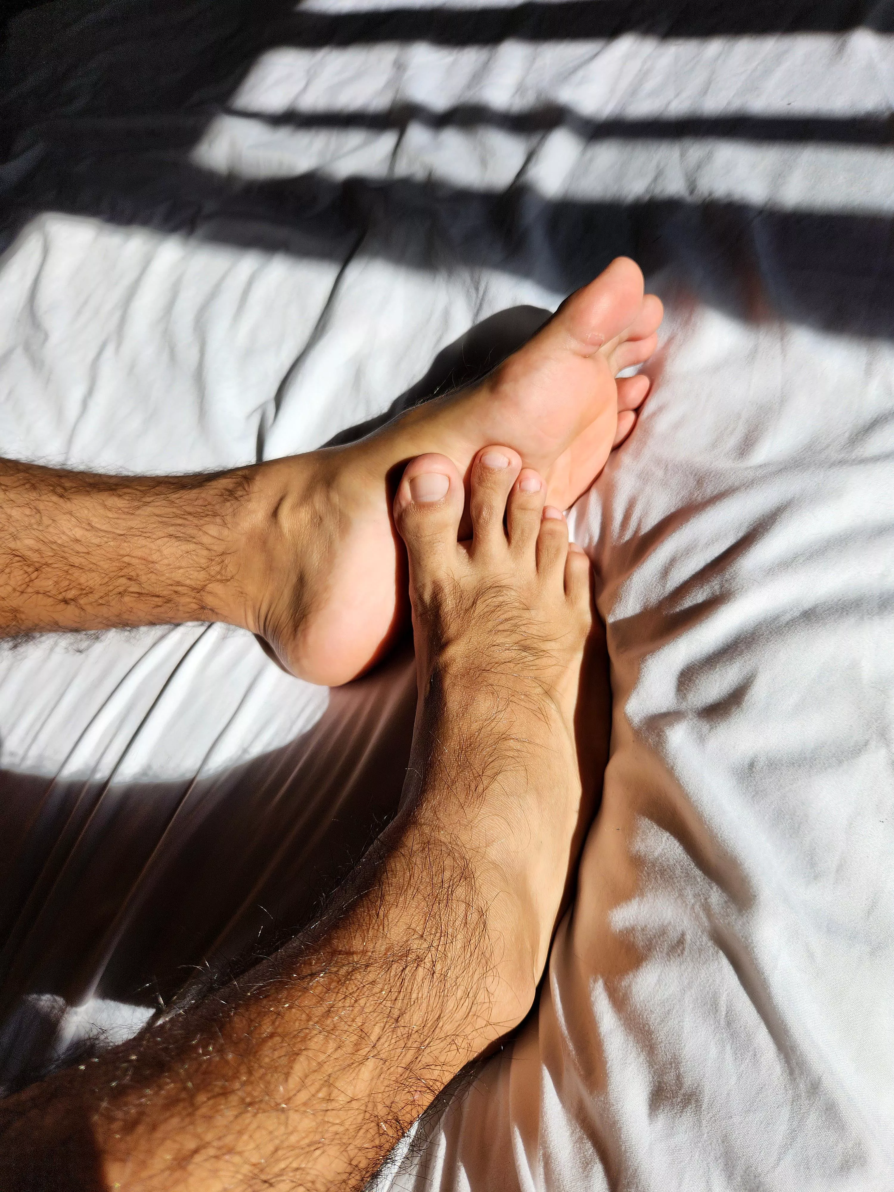 Soft touch of toes on soles