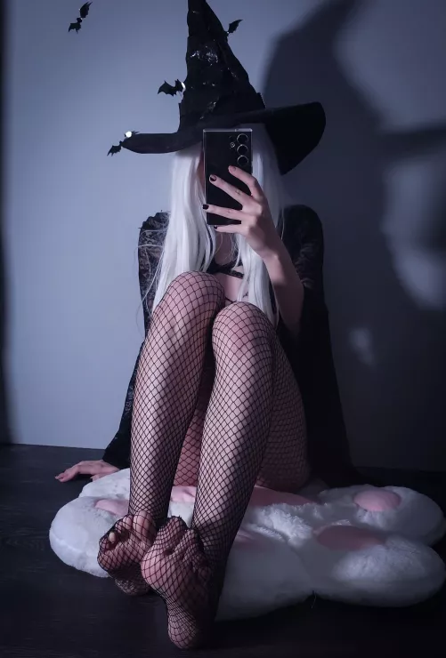 witch feet in fishnets