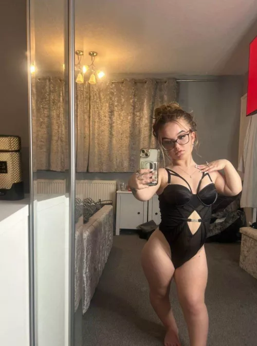 A small girl dressed in smaller clothes