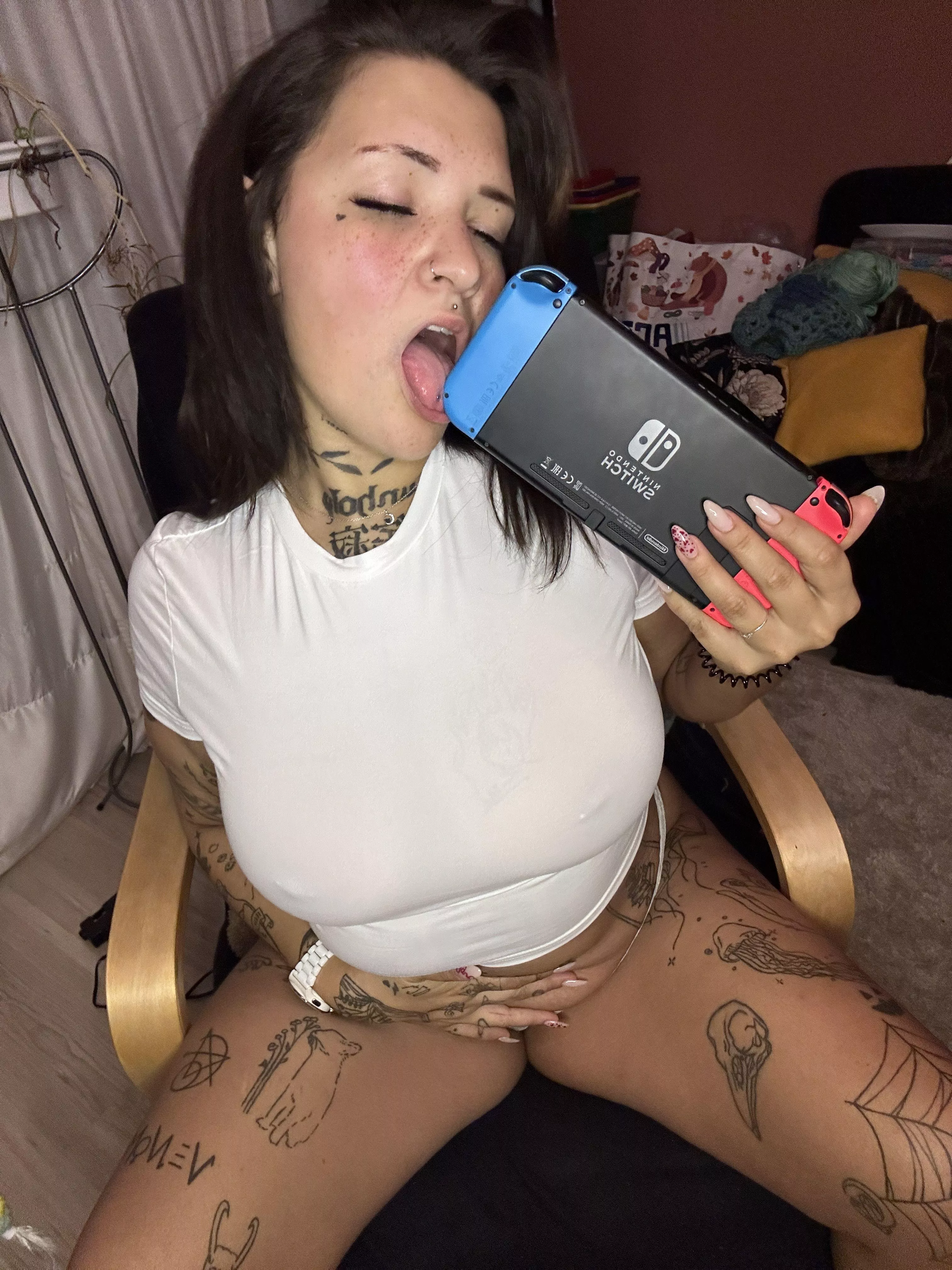 gamer girl with a knack for naughtiness, ready for some controller-driven fun...