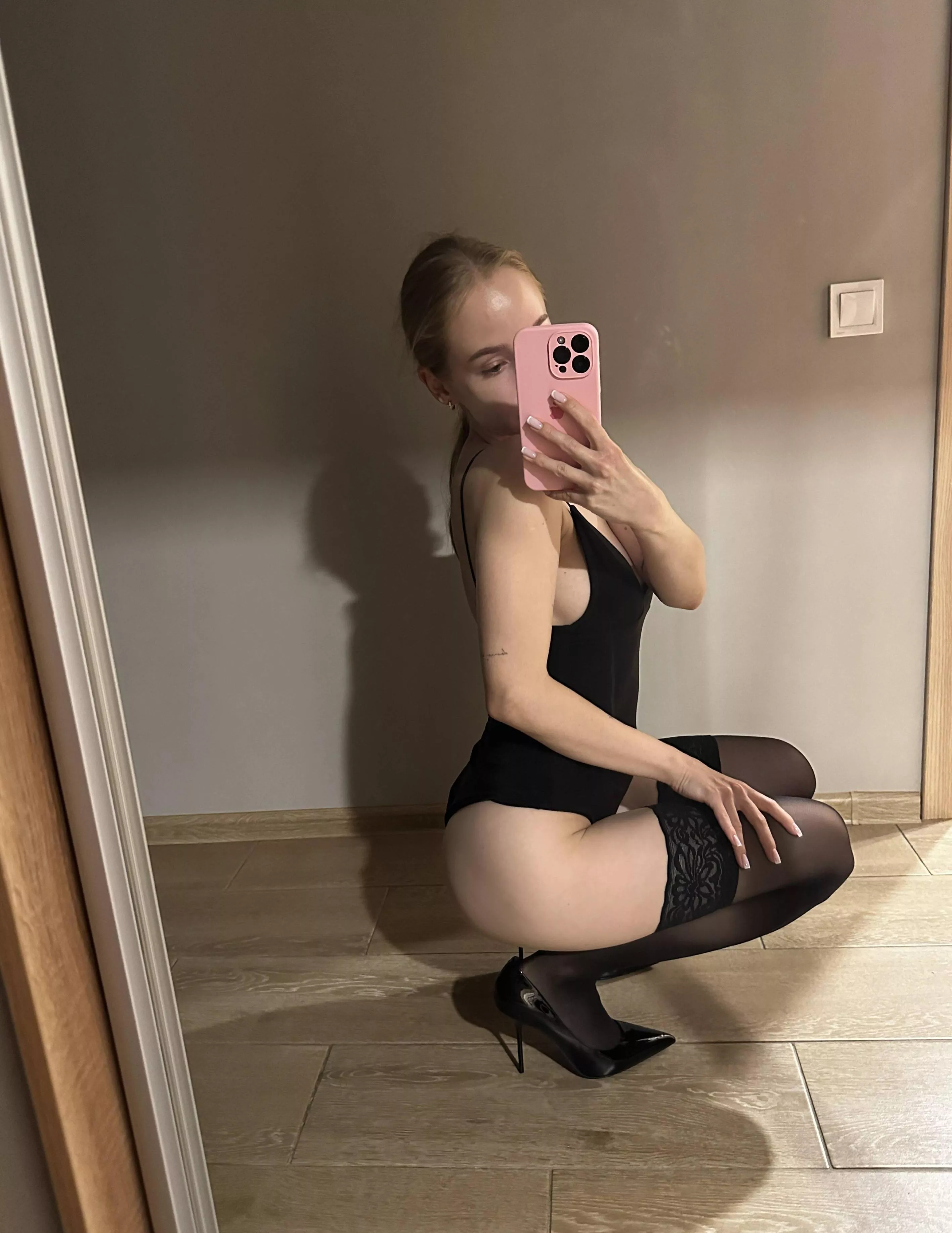 Black stockings and black heels are a girl's best friend, the only thing missing is diamonds