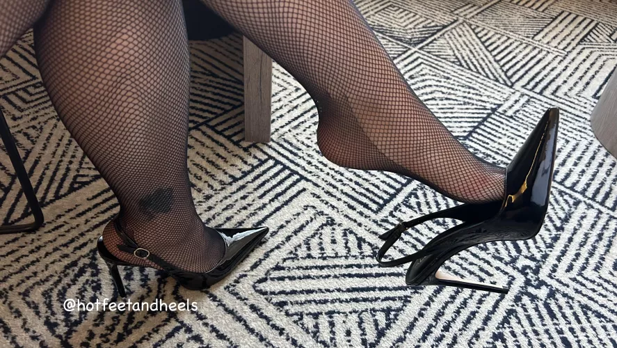 Dangling my black patent Sling Heels