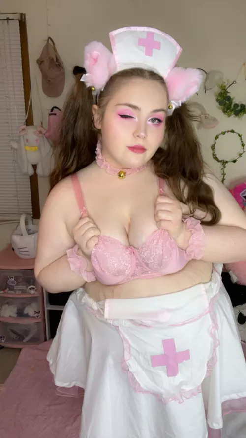 nurse kitty is ready for her next patient 