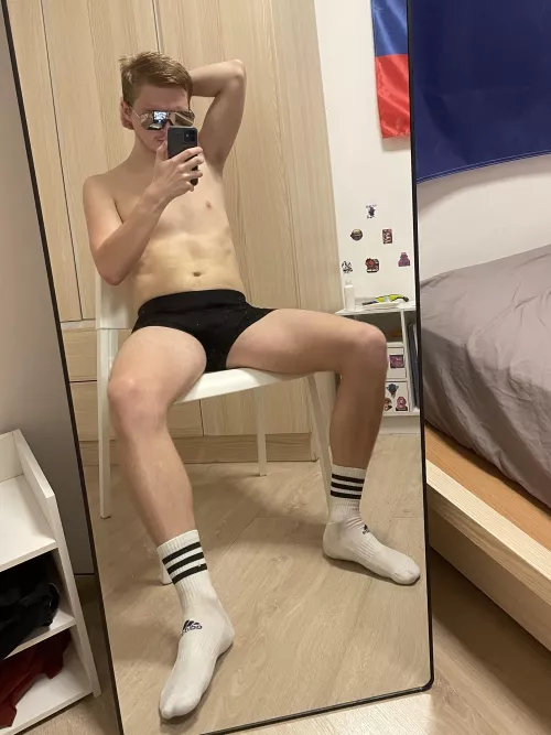 Socks on, shirt off, and serving up that post-workout glow 💪🏻🧦