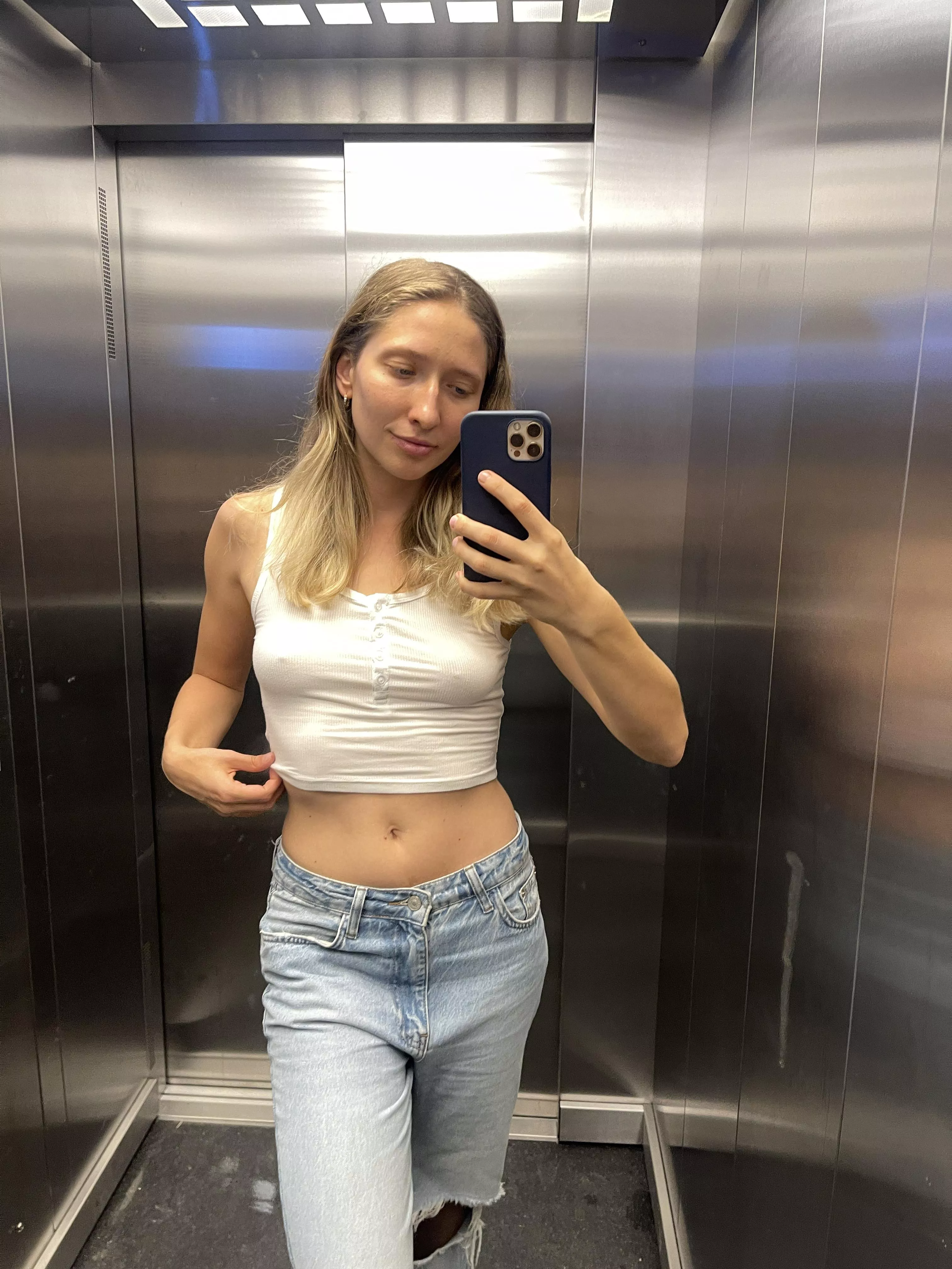 Showing my belly in the lift