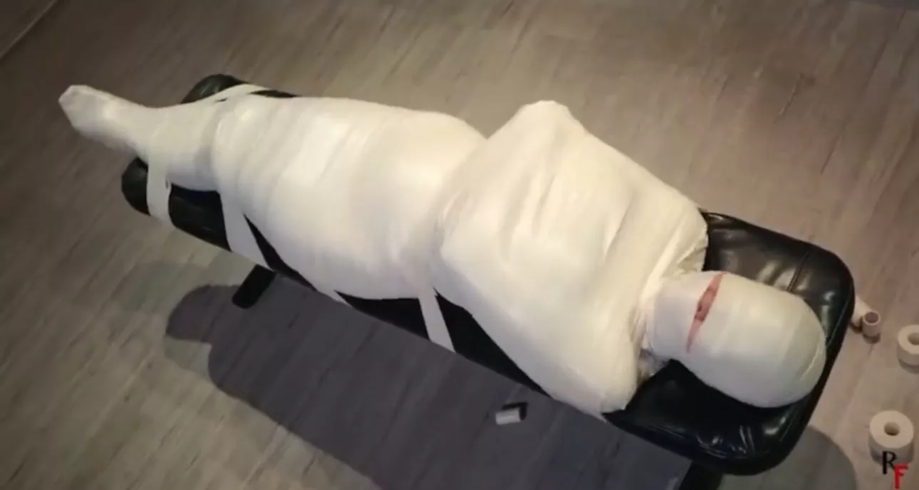 After sharing a fantasy of permanent mummification with my dom, they took it upon themselves to wrap me up like this, while I was asleep of course. Waking up like this was terrifying, even more so was how time drug on. I think that was years ago? They'r