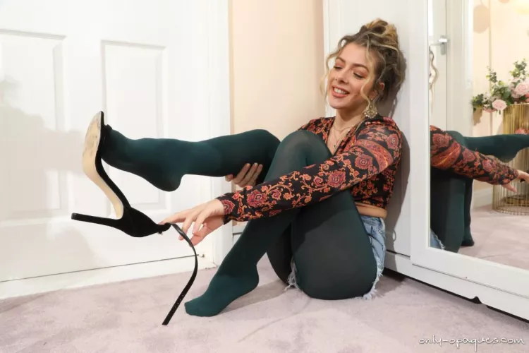 Tillie teasing in her jean shorts, high heels and green opaque pantyhose