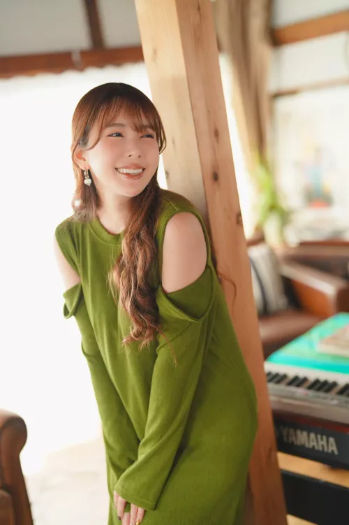 Smiling in a green dress