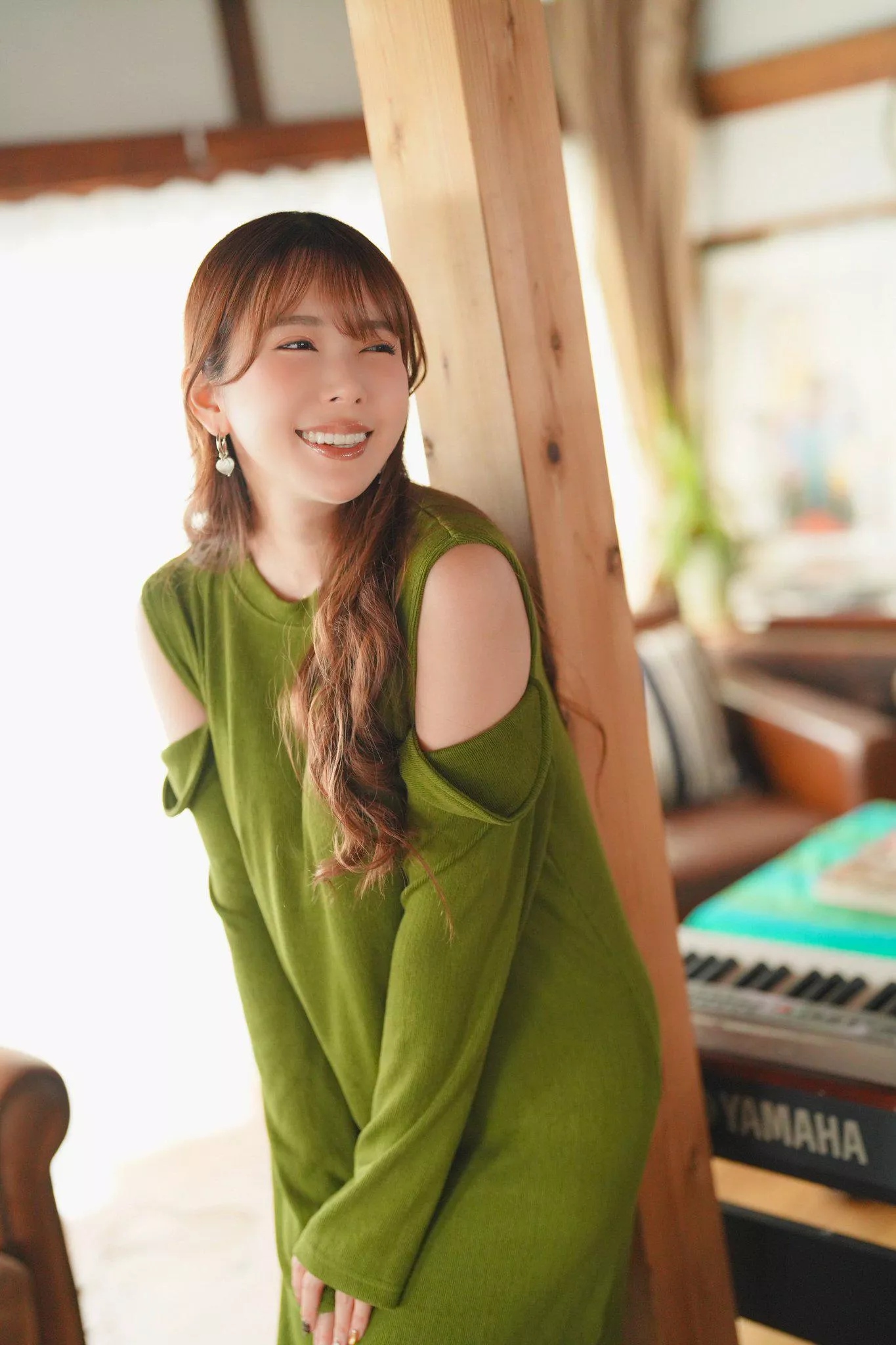Smiling in a green dress
