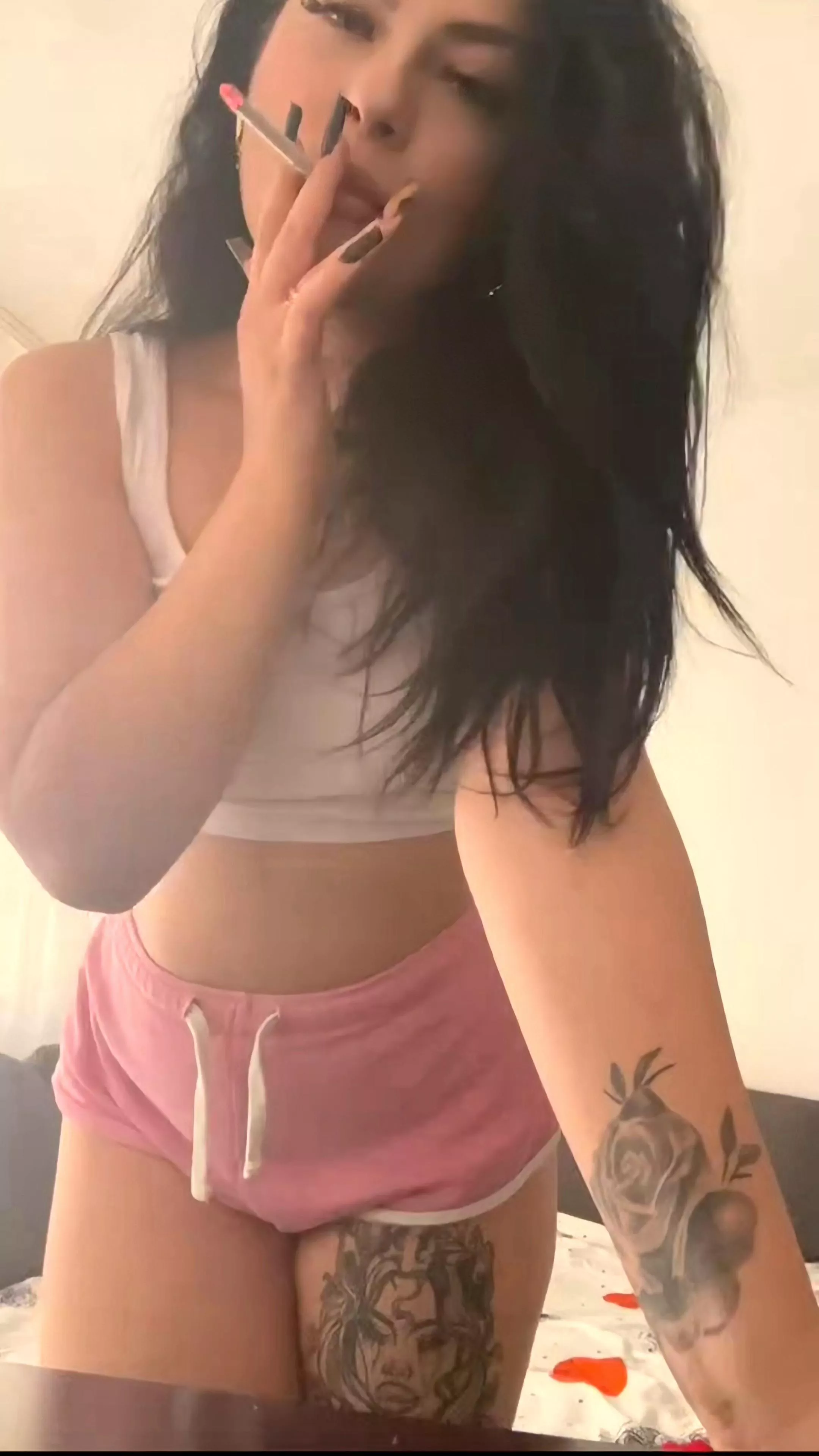 Lounging around the house enjoying my cigarette.