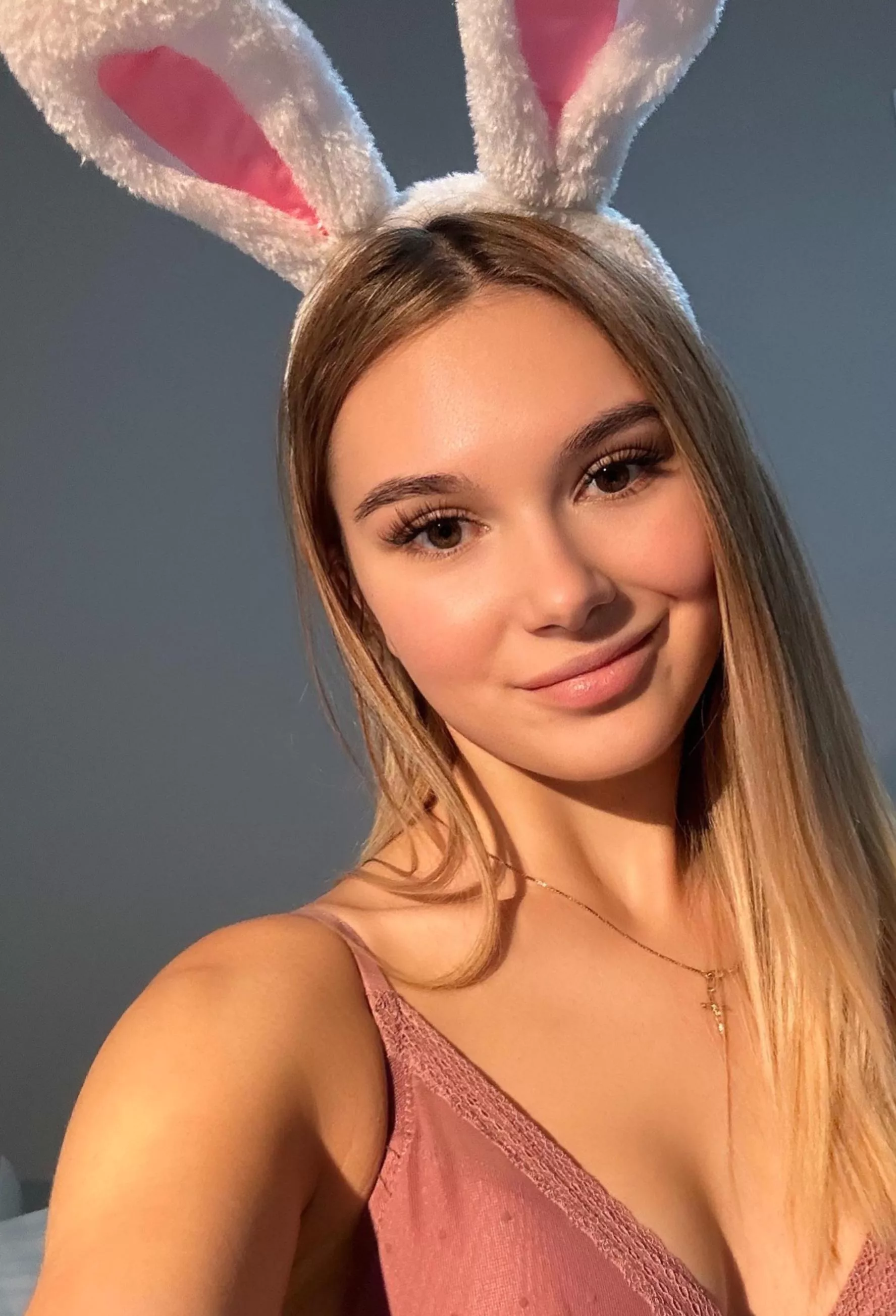 This naughty bunny needs a carrot between her feet