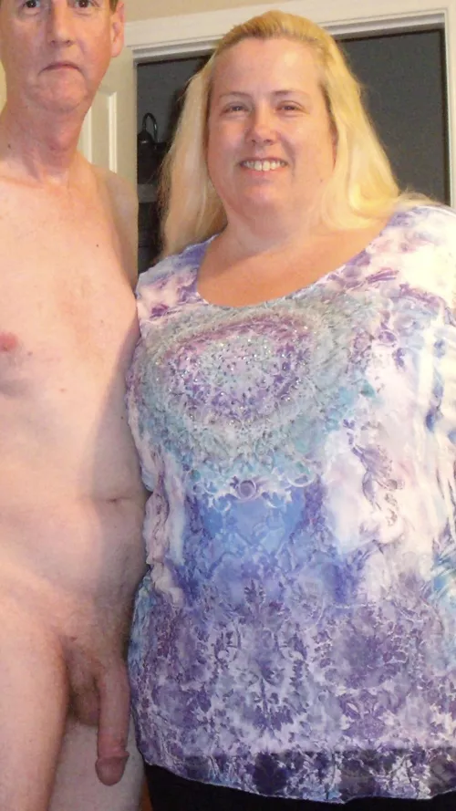 She seems comfortable having her picture taken in a CFNM situation!