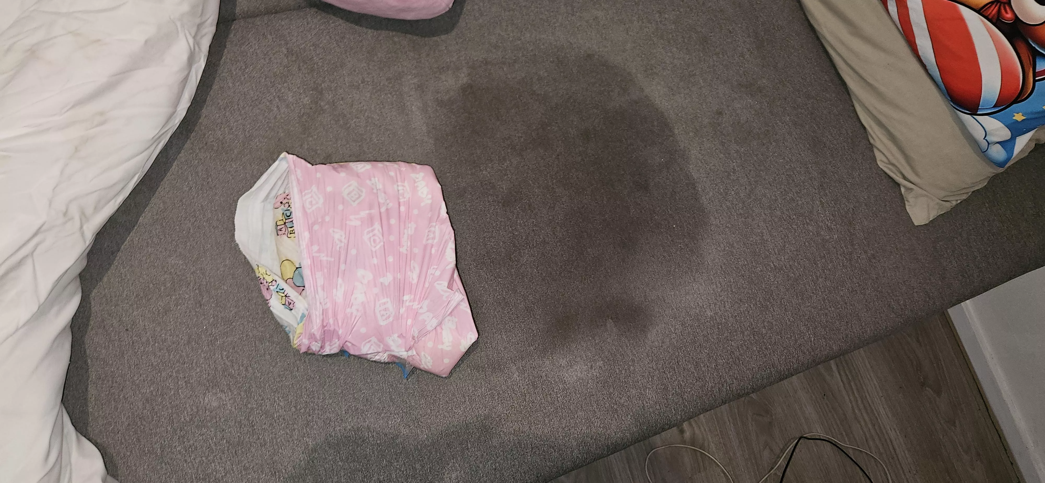 Diaper Boy slept a little too soundly. Diaper Boy peed his diaper so much that the bed got wet from the pee.