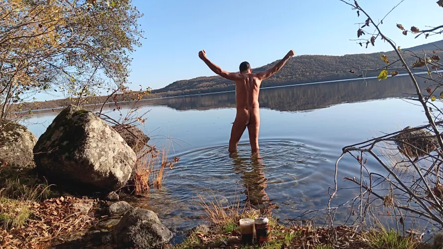 In the lake. Autumn nudist bath
