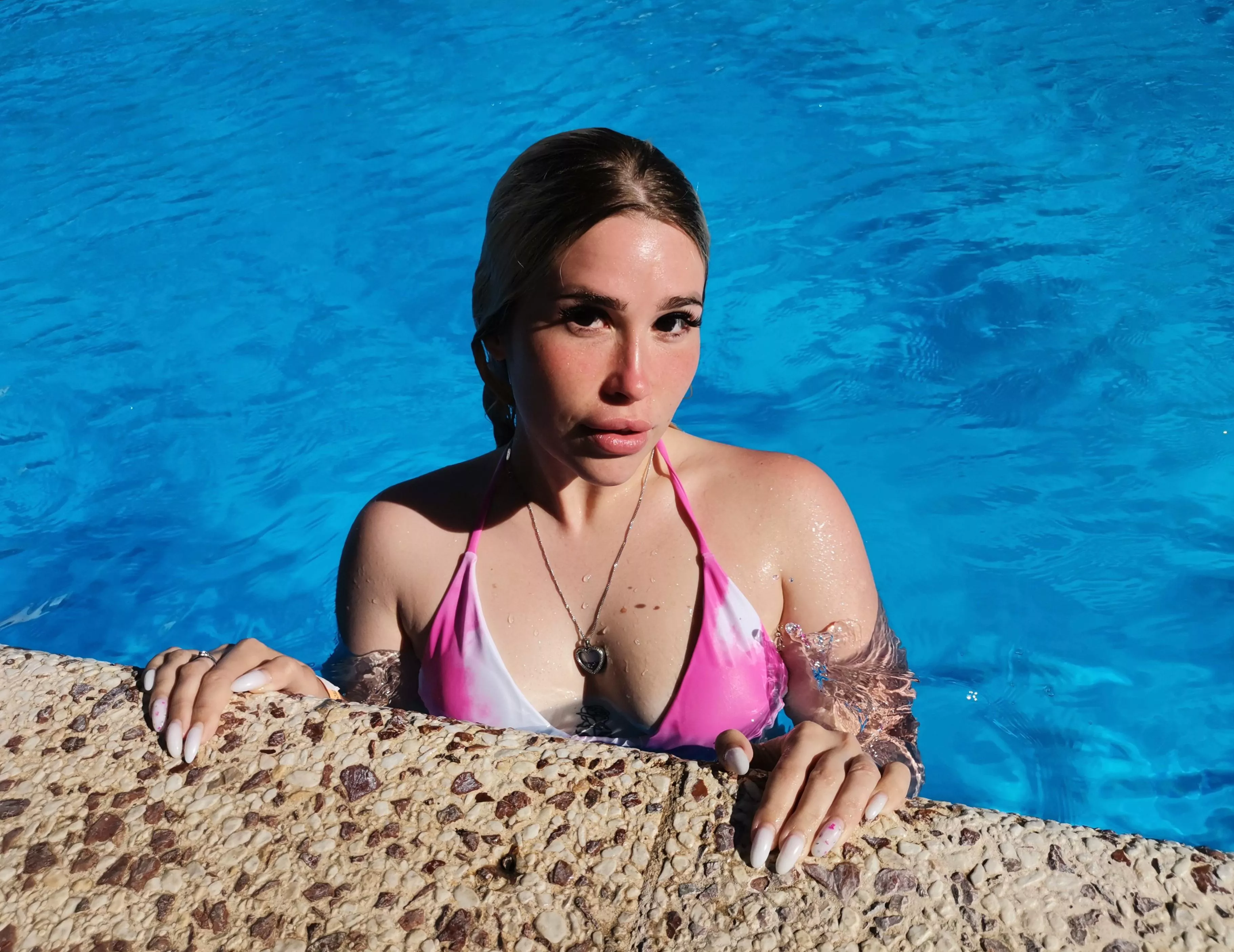 Pool time for this girl in a swimsuit