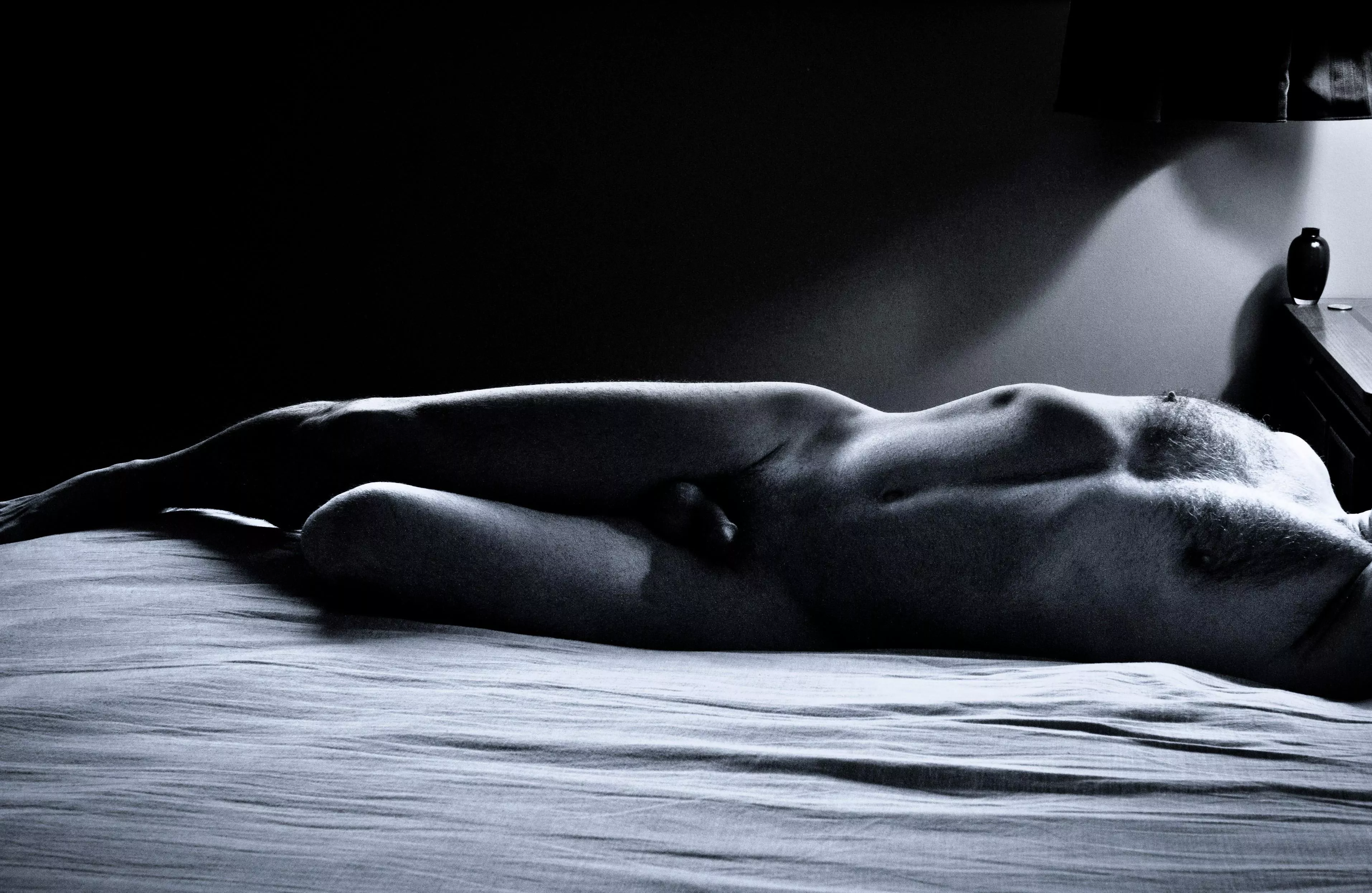 Mature male nude on bed