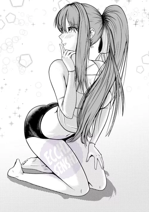 Monika sitting flirtatiously 
