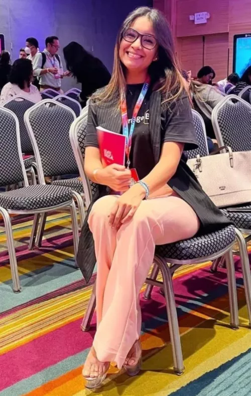 Casually wearing her clear stripper heels at a conference 