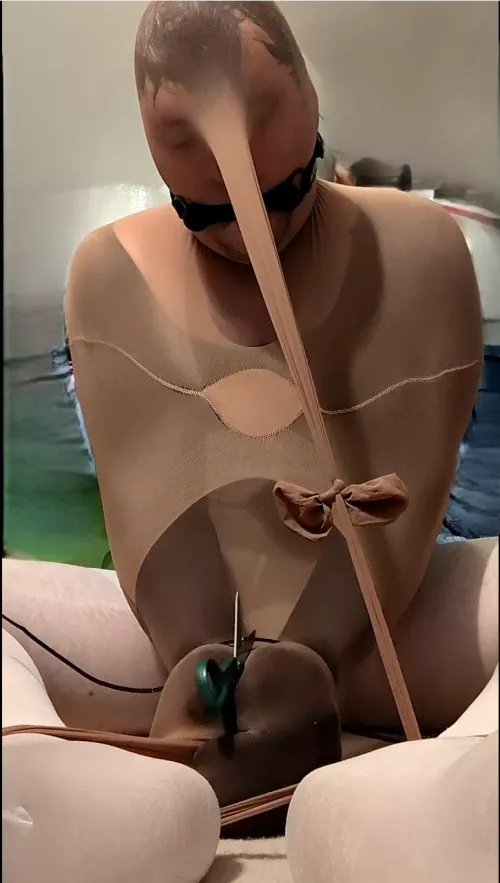 Another selfbondage pic trying to cut the zipties around my wrists. I cut the one around my ankles but it took me a solid 10-15 minutes on these because the scissors I had kept sliding out of my pantyhosed, nylon grasp! I should have blindfolded myself t